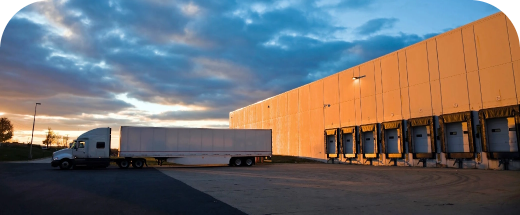 PLA truck at a loading dock at sunset