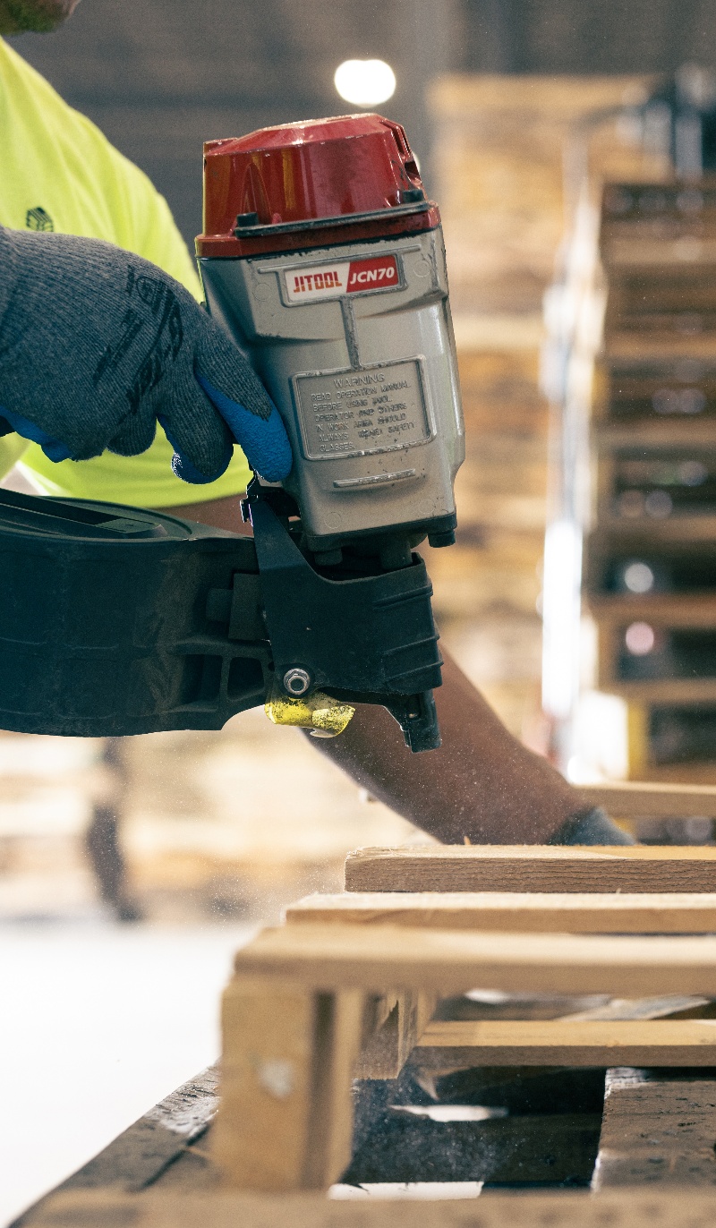 Nail gun repairing a pallet 